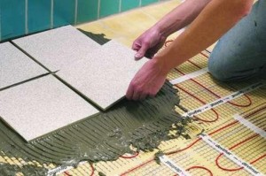 Закінчення роботи полягає в покритті підлоги плиткою або керамогранітом, тому що ці матеріали мають більшу теплопровідність